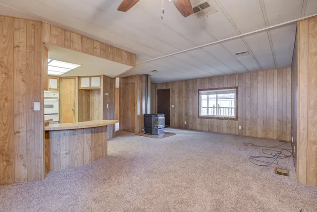 a view of a room with large windows