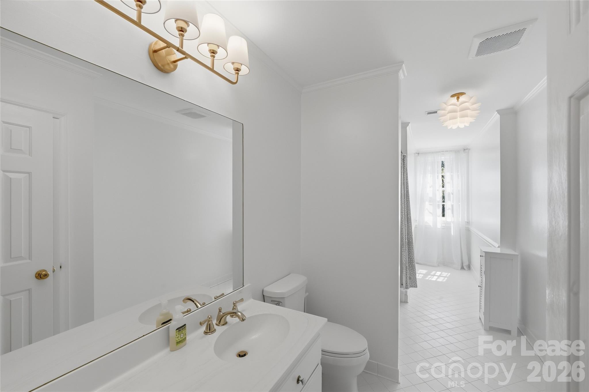5906 Sharon Hills Road Charlotte, NC 28210 - Photo 26 of 30 a bathroom with a sink a toilet and shower