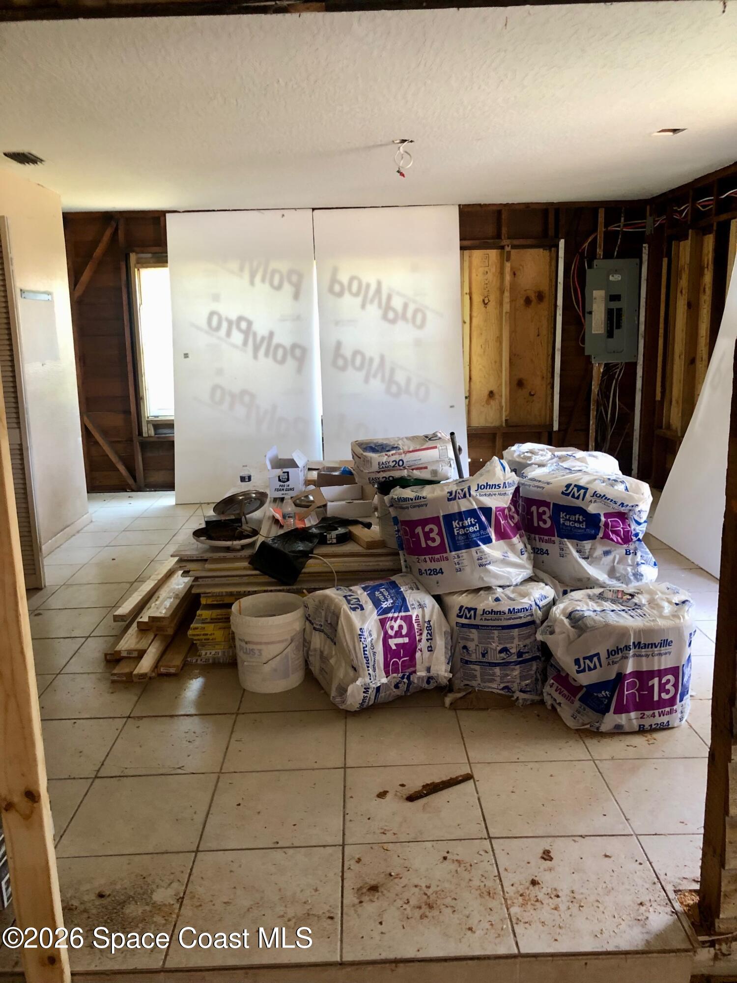 1236 Jackson Street Cocoa, FL 32922 - Photo 13 of 14 a room with lot of furniture and window