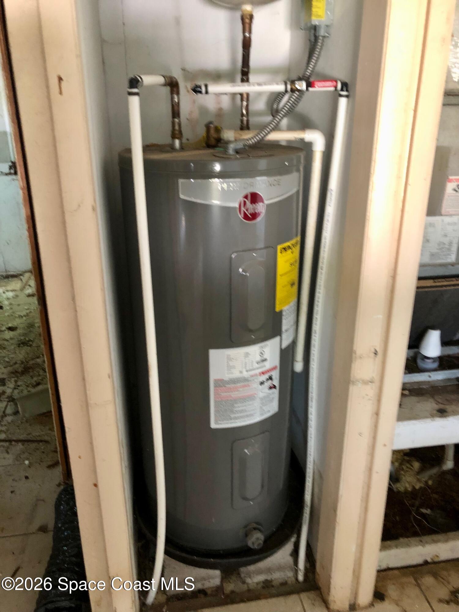 1236 Jackson Street Cocoa, FL 32922 - Photo 5 of 14 a room with water heater and refrigerator