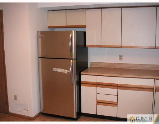 4705 Hana Road Edison, NJ 08817 - Photo 1 of 8 a white refrigerator freezer sitting in a kitchen