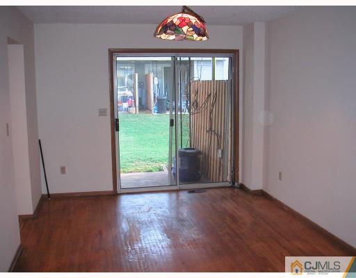 4705 Hana Road Edison, NJ 08817 - Photo 4 of 8 a view of an entryway with wooden floor
