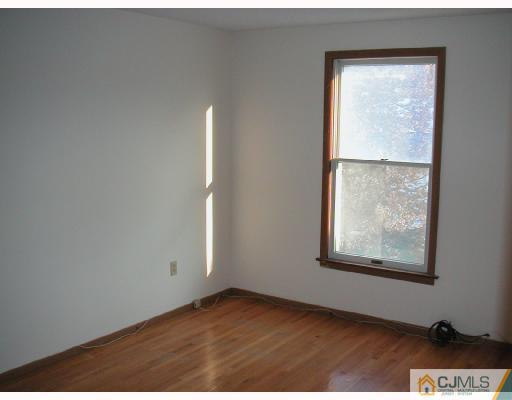 4705 Hana Road Edison, NJ 08817 - Photo 6 of 8 an empty room with windows