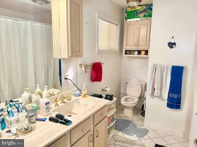 a bathroom with a sink toilet and vanity