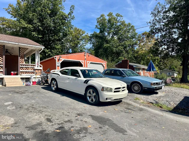 a front view of a house with parking space