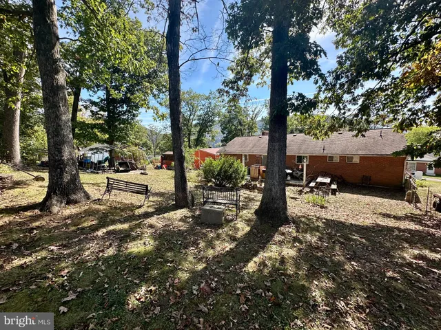 a backyard of a house with lots of green space