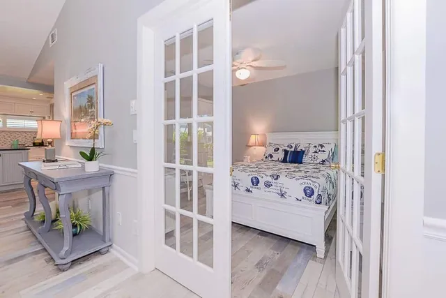 a view of a bedroom with a bed and a window