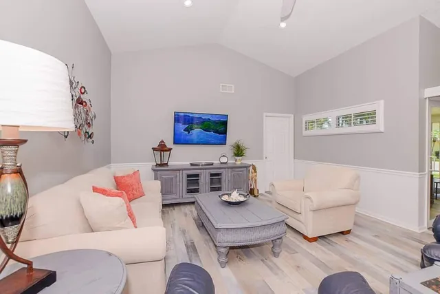 a living room with furniture and a couch