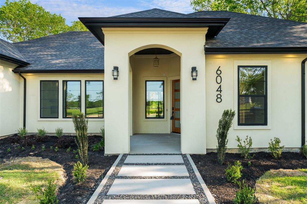 6048 Vz County Road, Unit 2120 Wills Point, TX 75169 - Photo 3 of 6 a front view of a house with garden