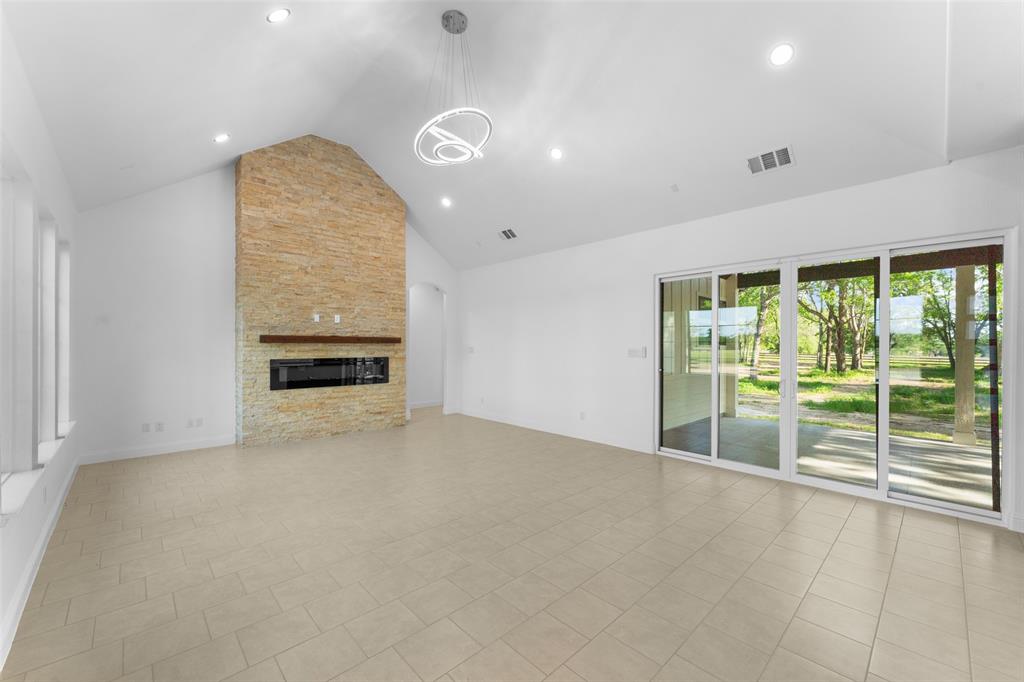 6048 Vz County Road, Unit 2120 Wills Point, TX 75169 - Photo 5 of 6 an empty room with floor to ceiling windows and outdoor view