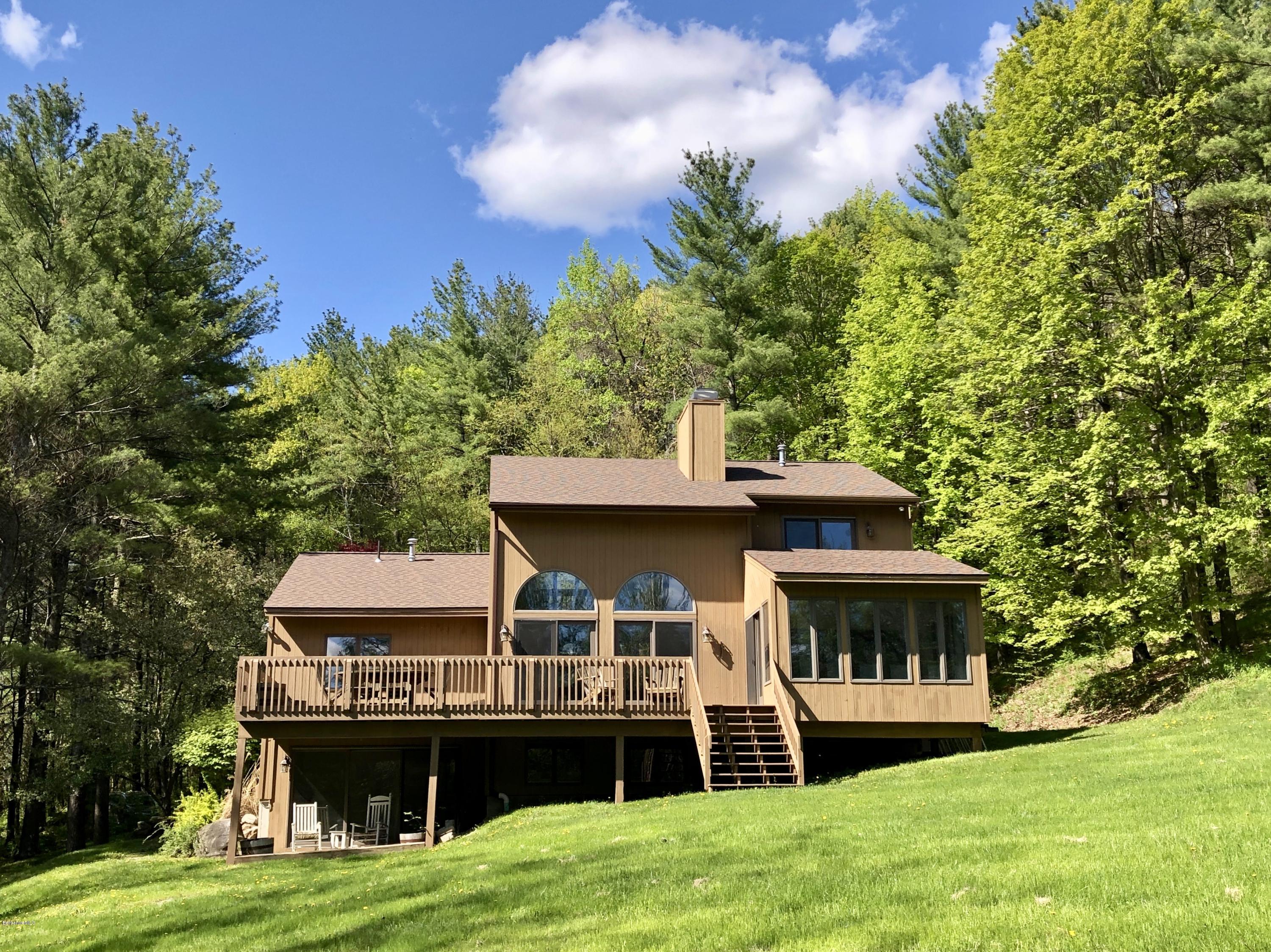 755 Tyringham Road Lee, MA 01238 - Photo 2 of 32 a front view of a house with garden