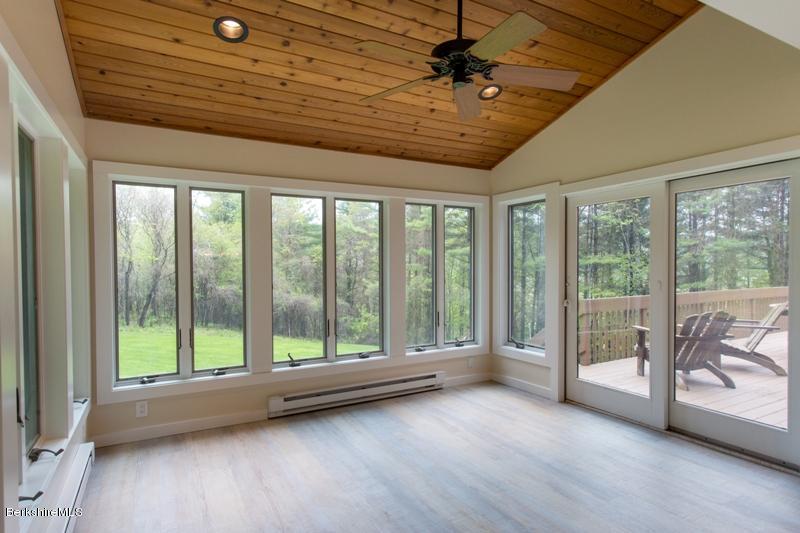 755 Tyringham Road Lee, MA 01238 - Photo 11 of 32 a view of room with window and hardwood