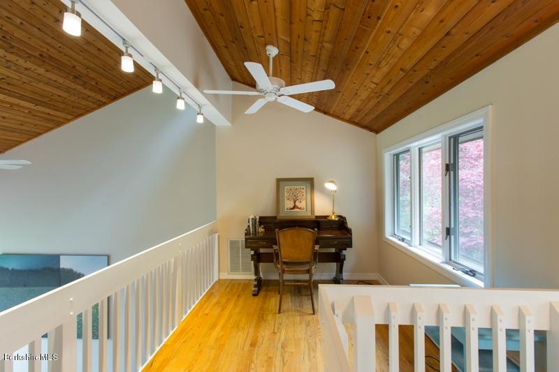 755 Tyringham Road Lee, MA 01238 - Photo 15 of 32 a view of a workspace with furniture and a window