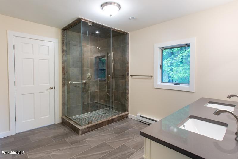 755 Tyringham Road Lee, MA 01238 - Photo 20 of 32 a bathroom with a sink a toilet and shower