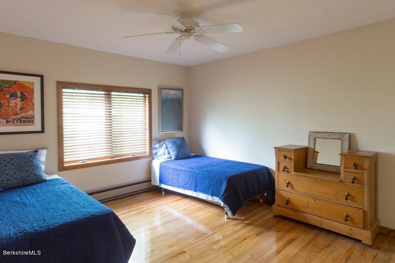 755 Tyringham Road Lee, MA 01238 - Photo 25 of 32 a bedroom with a bed and a window