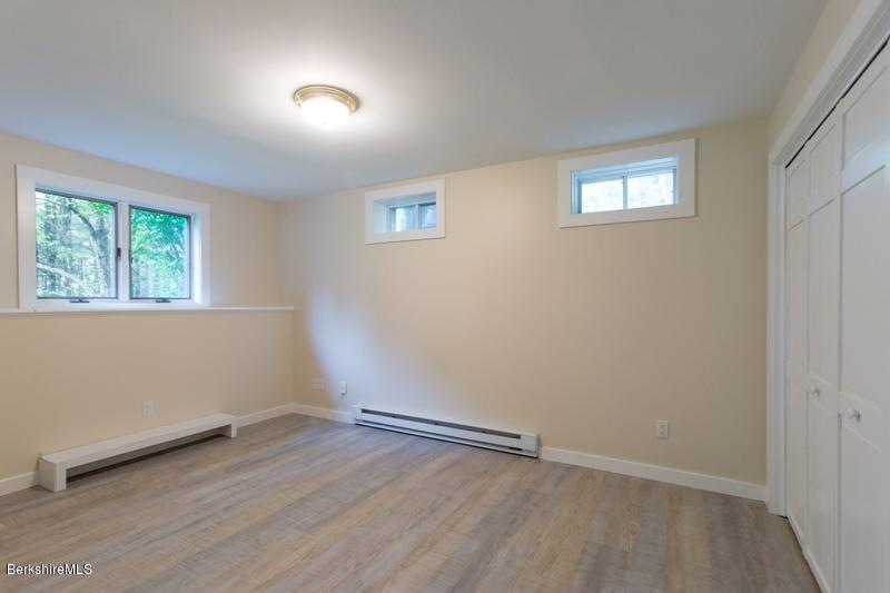 755 Tyringham Road Lee, MA 01238 - Photo 27 of 32 an empty room with a window