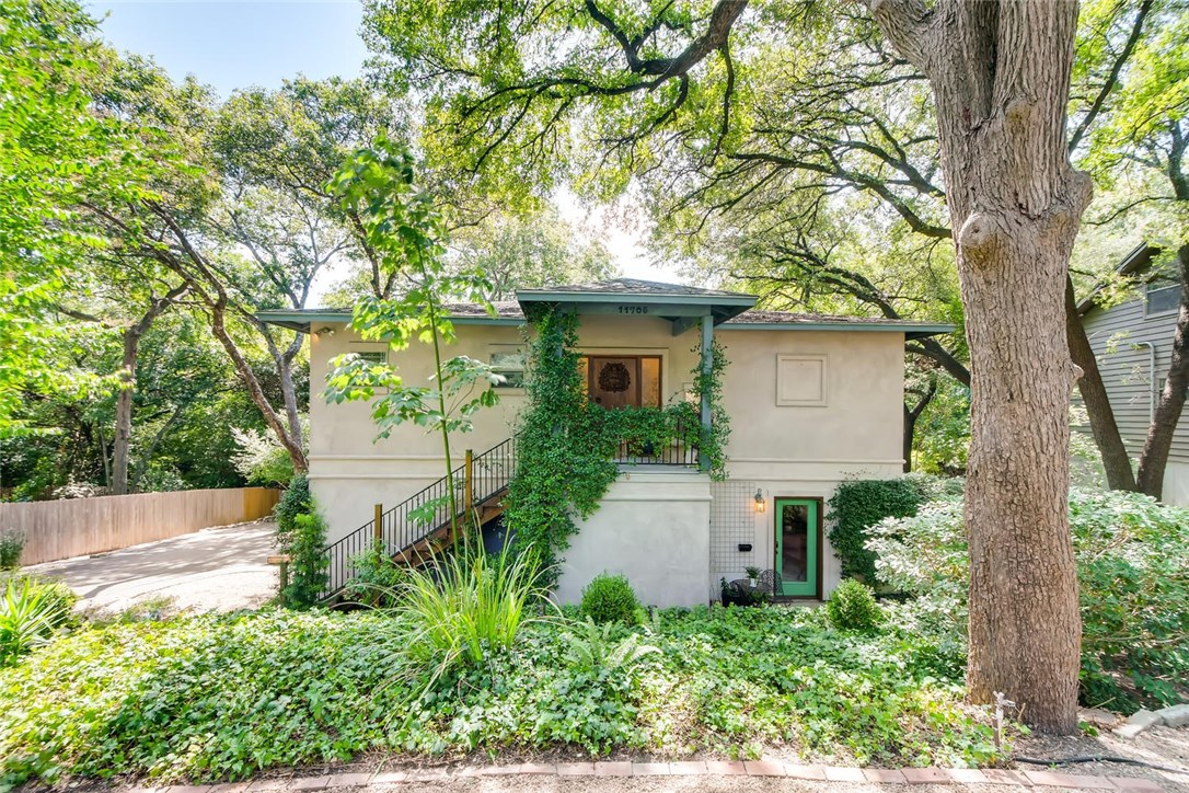 11705 Eubank Drive Austin, TX 78758 - Photo 1 of 1 a front view of a house with a yard and trees