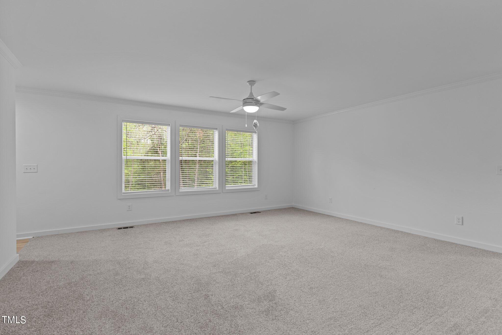 474 Street's Store Road Roxboro, NC 27574 - Photo 15 of 49 an empty room with a ceiling fan and window