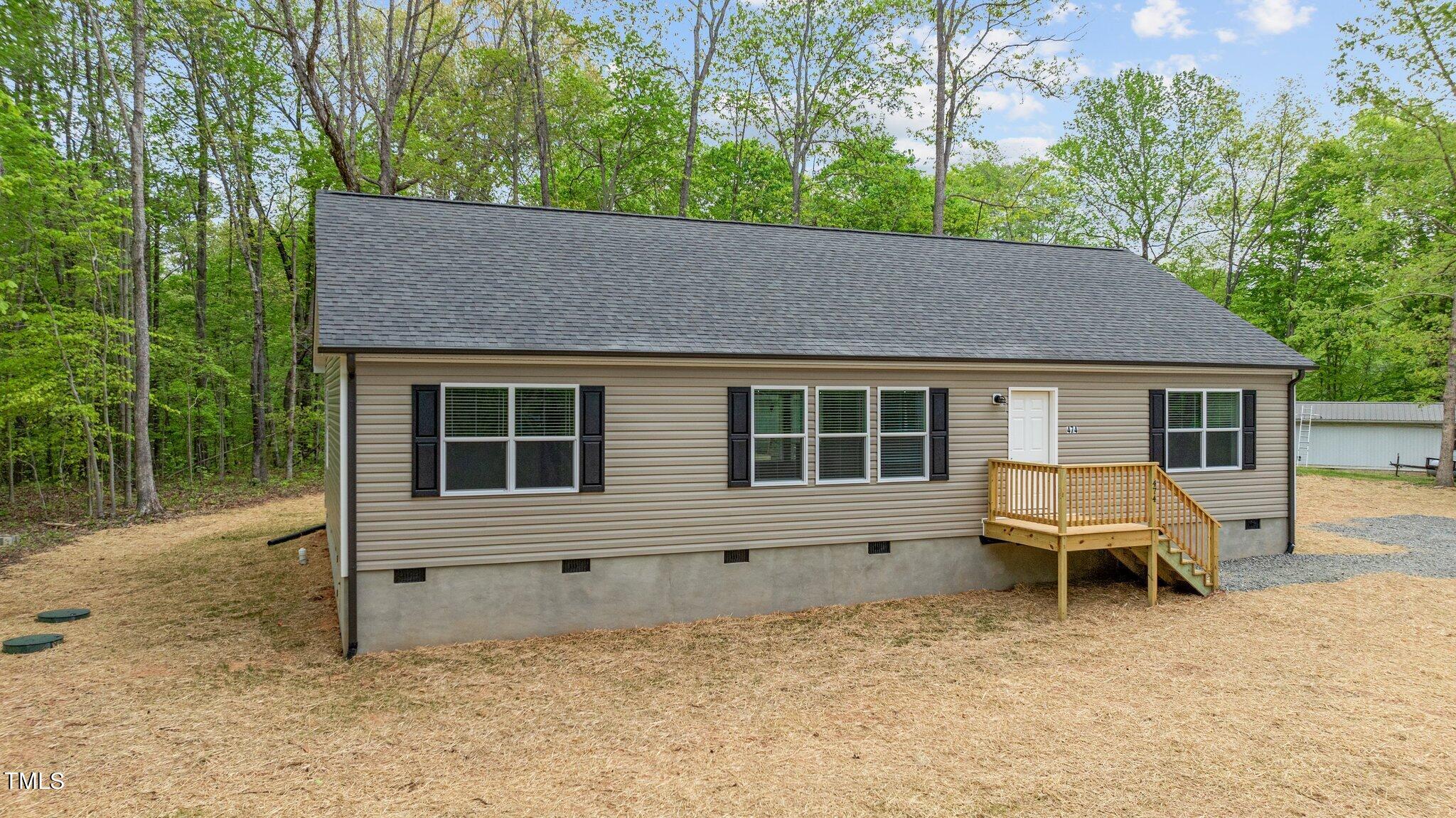 474 Street's Store Road Roxboro, NC 27574 - Photo 3 of 49 a backyard of a house with table and chairs