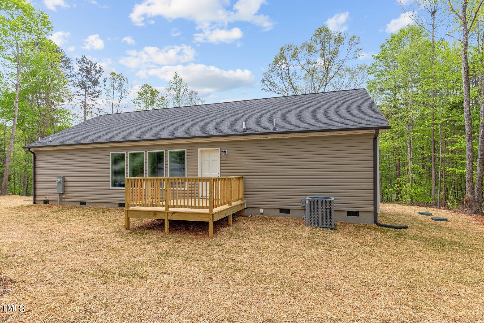 474 Street's Store Road Roxboro, NC 27574 - Photo 34 of 49 a backyard of a house with table and chairs