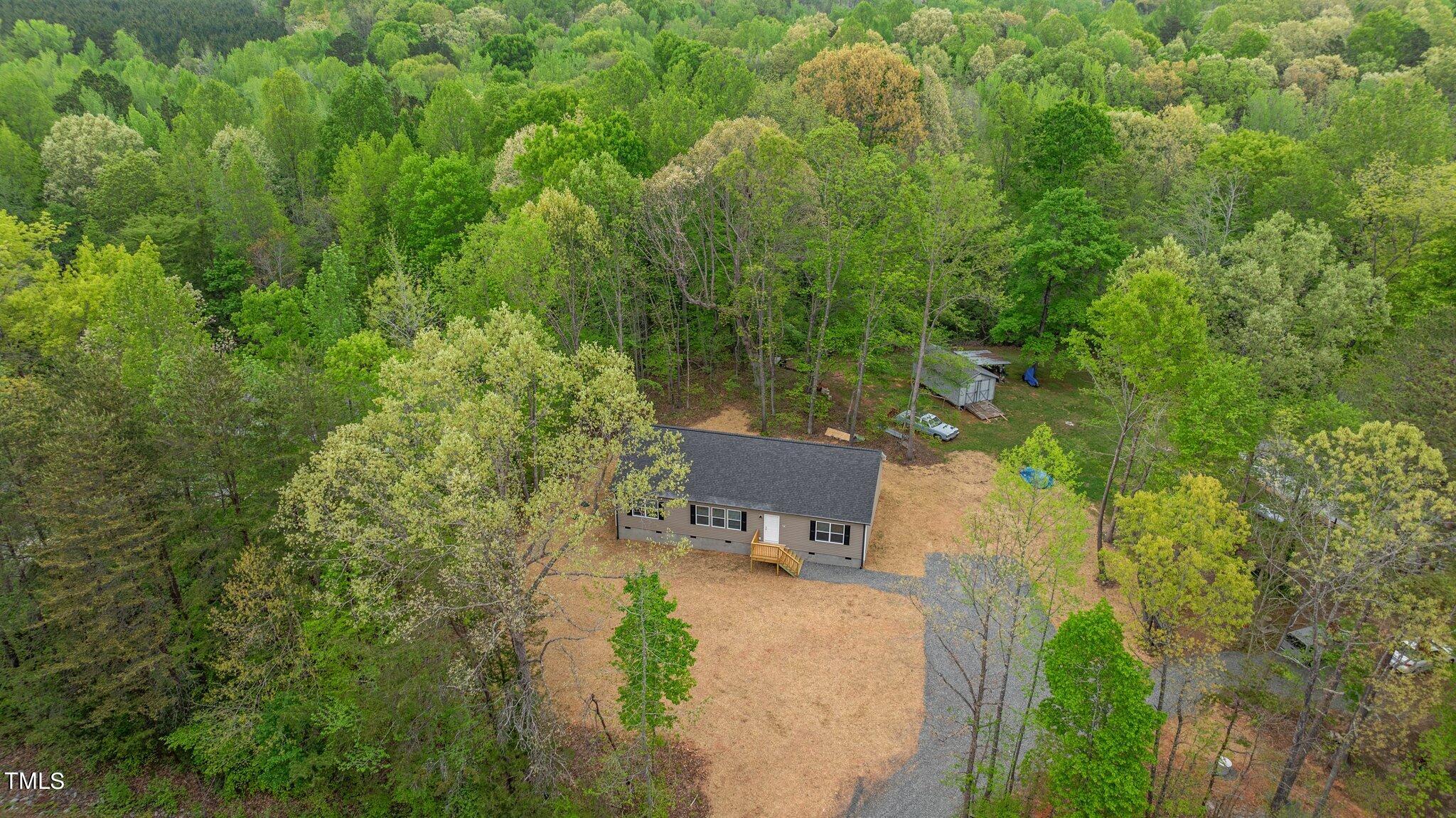 474 Street's Store Road Roxboro, NC 27574 - Photo 48 of 49 a view of a garden with a bench