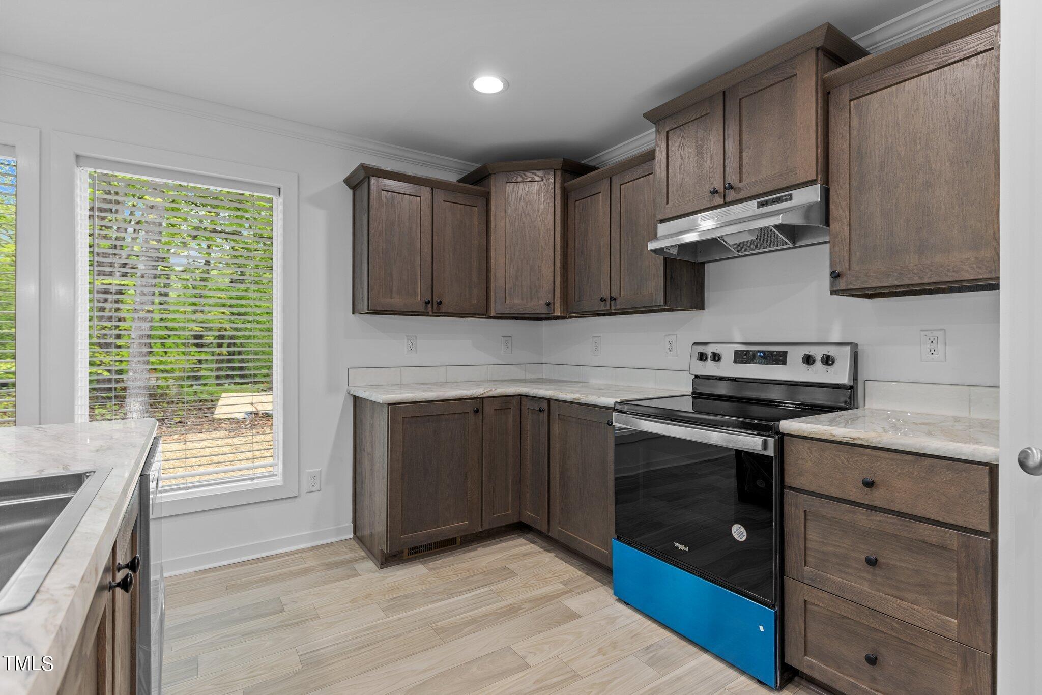 474 Street's Store Road Roxboro, NC 27574 - Photo 9 of 49 a kitchen with granite countertop a stove and a sink