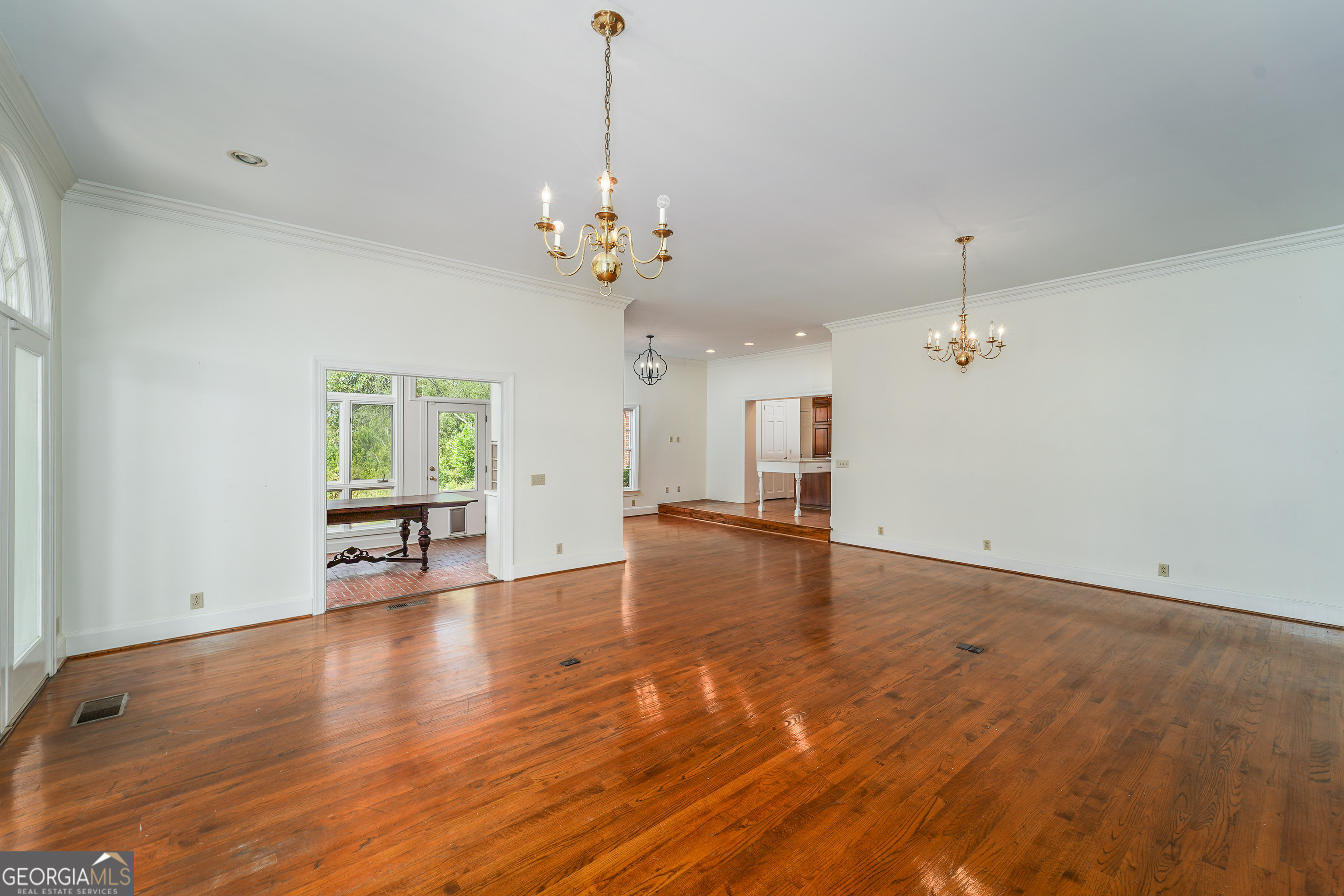 1602 Ward St Extension West Douglas, GA 31533 - Photo 37 of 70 a view of an empty room with a window and wooden floor