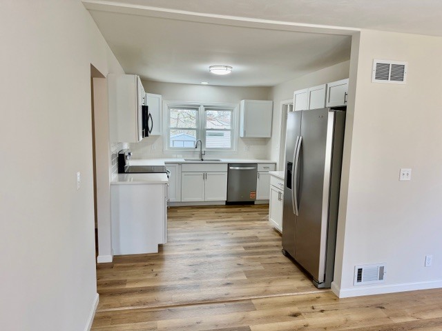 109 South Elm Street Lexington, IL 61753 - Photo 2 of 20 a kitchen with stainless steel appliances granite countertop a refrigerator and a stove top oven