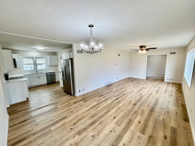 109 South Elm Street Lexington, IL 61753 - Photo 3 of 20 a view of a big room with wooden floor and windows
