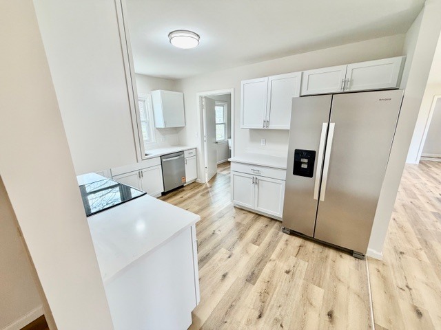 109 South Elm Street Lexington, IL 61753 - Photo 6 of 20 a kitchen with stainless steel appliances a refrigerator and a stove