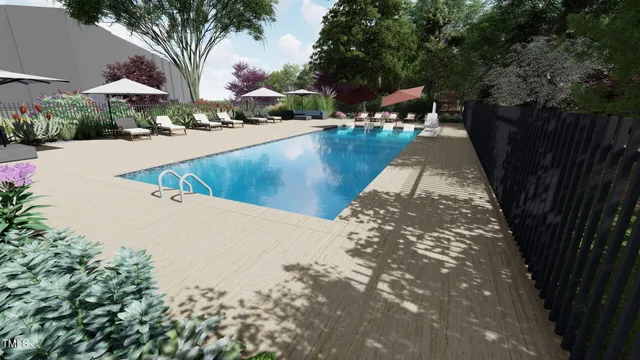 a view of a swimming pool and lounge chairs