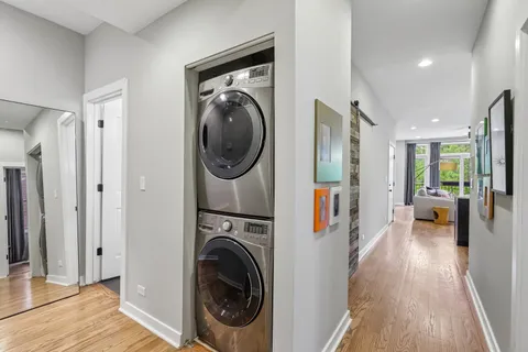 a view of a hallway with washer and dryer