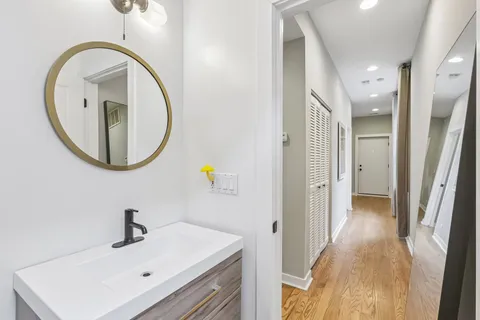 a bathroom with a sink and a mirror
