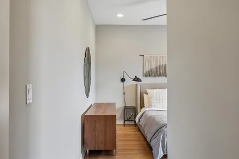 a room with wooden floor and entryway