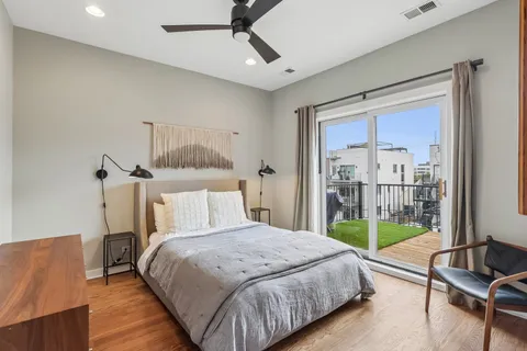 a bed sitting in a bedroom next to a window