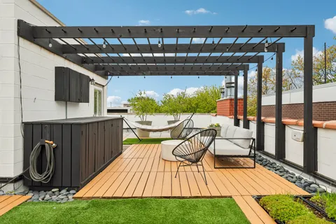 a view of a chairs and table in patio