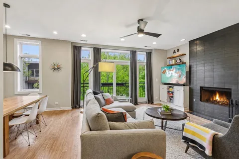 a living room with furniture and a fireplace