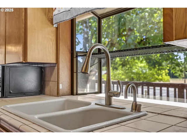 a view of a living room and floor to ceiling window