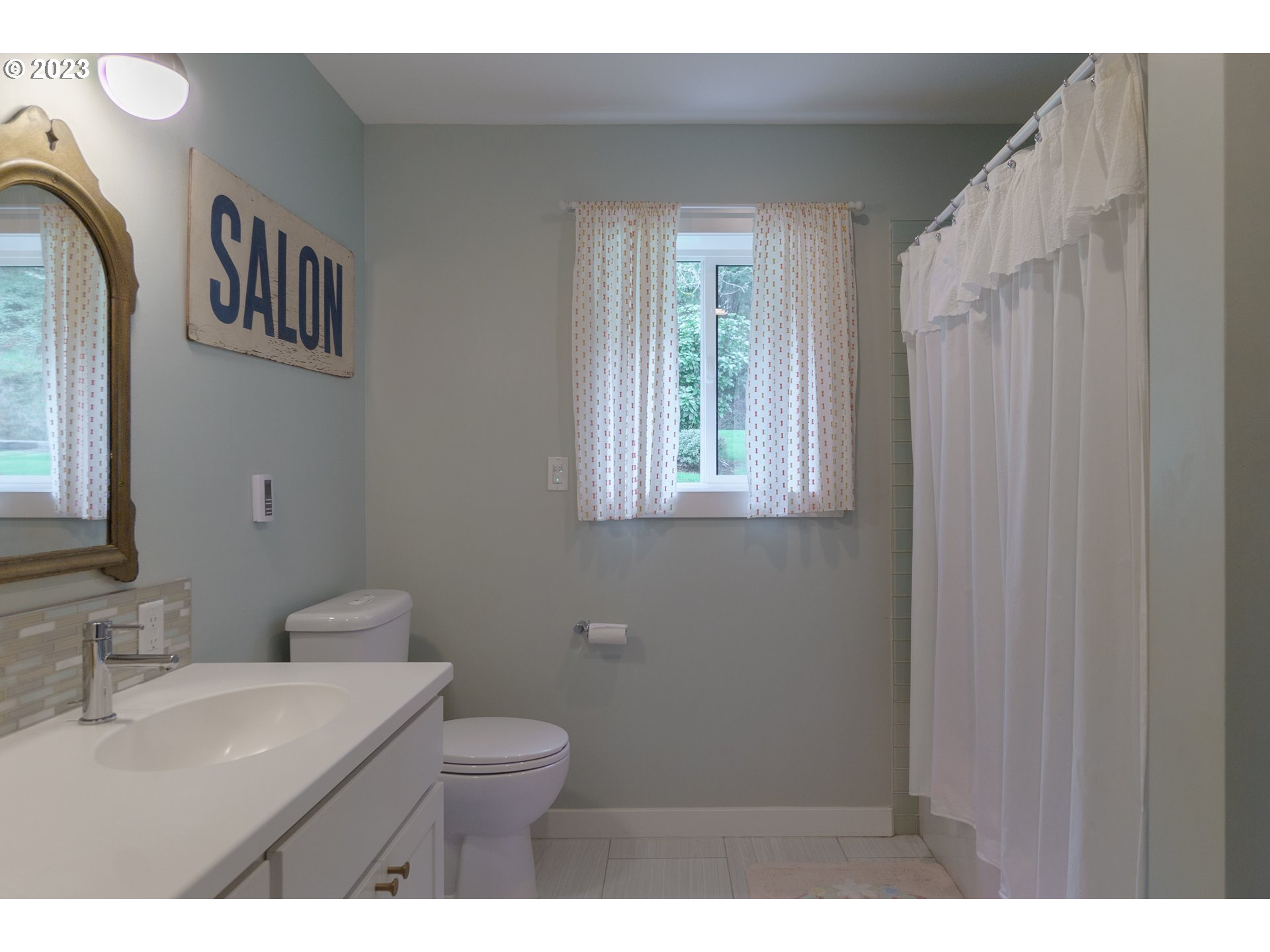 35243 McKenzie View Drive Springfield, OR 97478 - Photo 11 of 23 a bathroom with a toilet a sink and mirror
