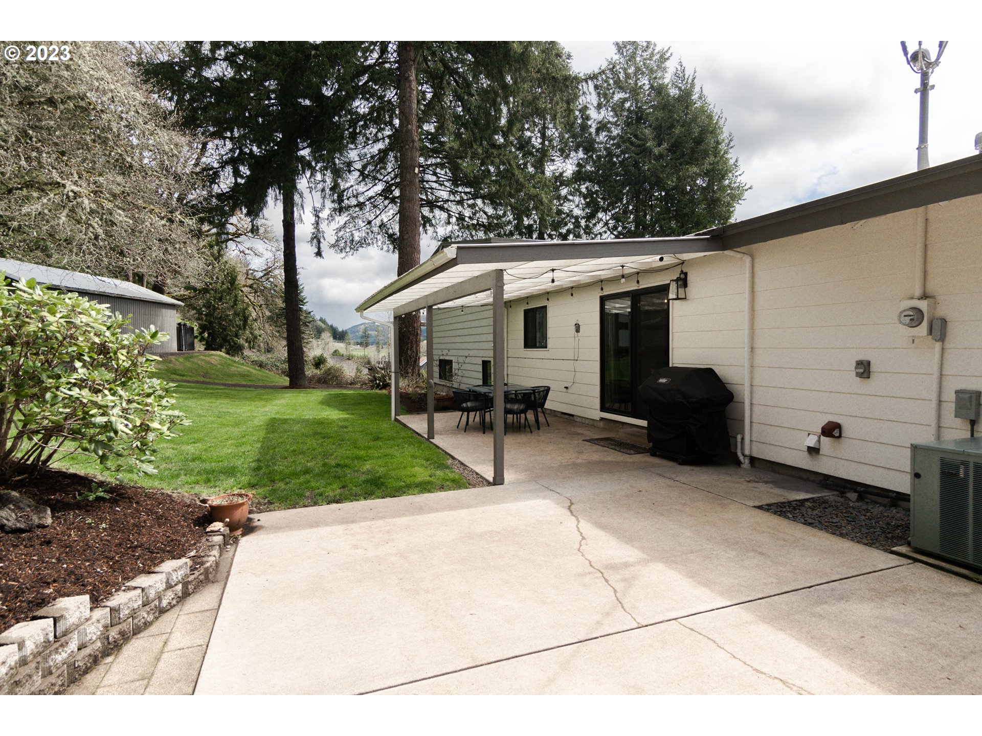 35243 McKenzie View Drive Springfield, OR 97478 - Photo 17 of 23 a view of a patio with a yard