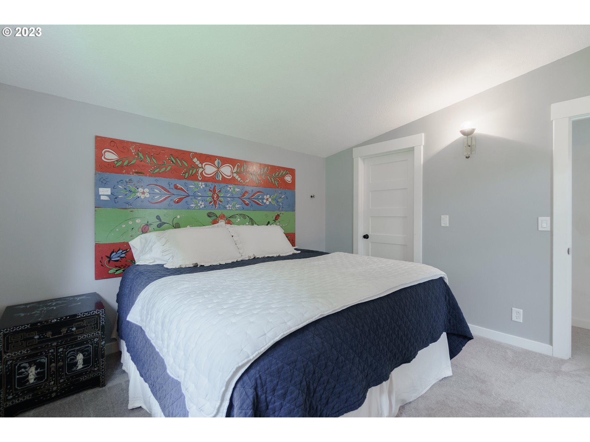 35243 McKenzie View Drive Springfield, OR 97478 - Photo 8 of 23 a bedroom with a bed and a painting on the wall