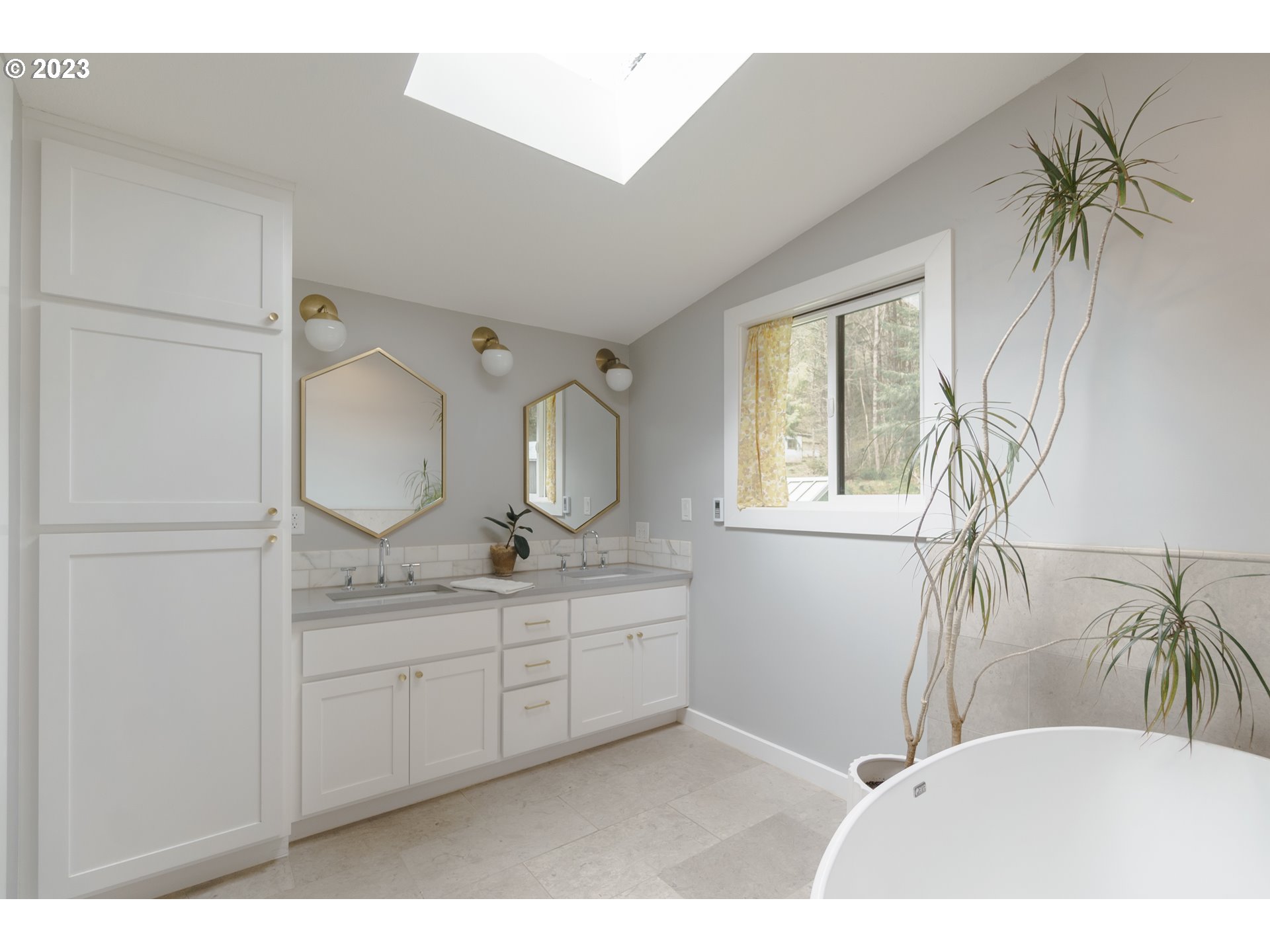 35243 McKenzie View Drive Springfield, OR 97478 - Photo 9 of 23 a bathroom with a double vanity sink a mirror and a shower