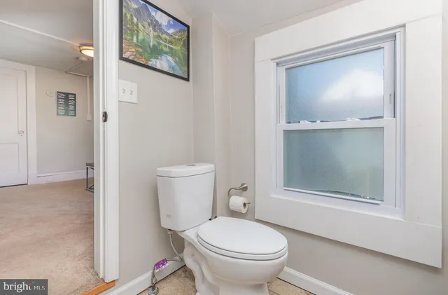 a bathroom with a toilet and a sink