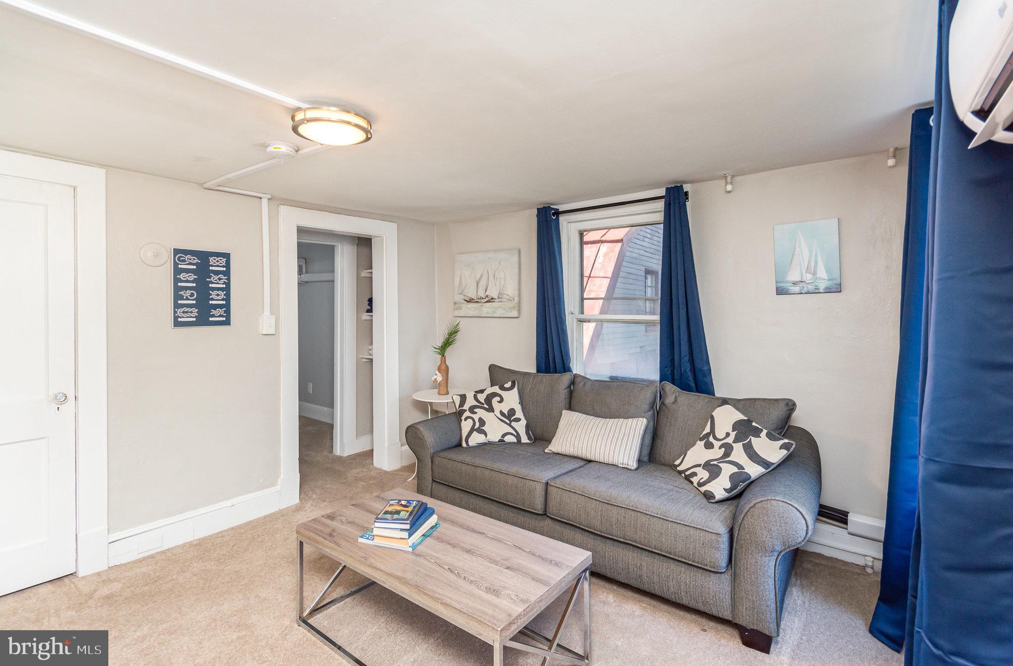 126 Prince George Street, Unit 4 Annapolis, MD 21401 - Photo 3 of 15 a living room with furniture and a window