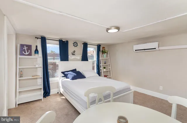 a bedroom with a bed and a cabinets