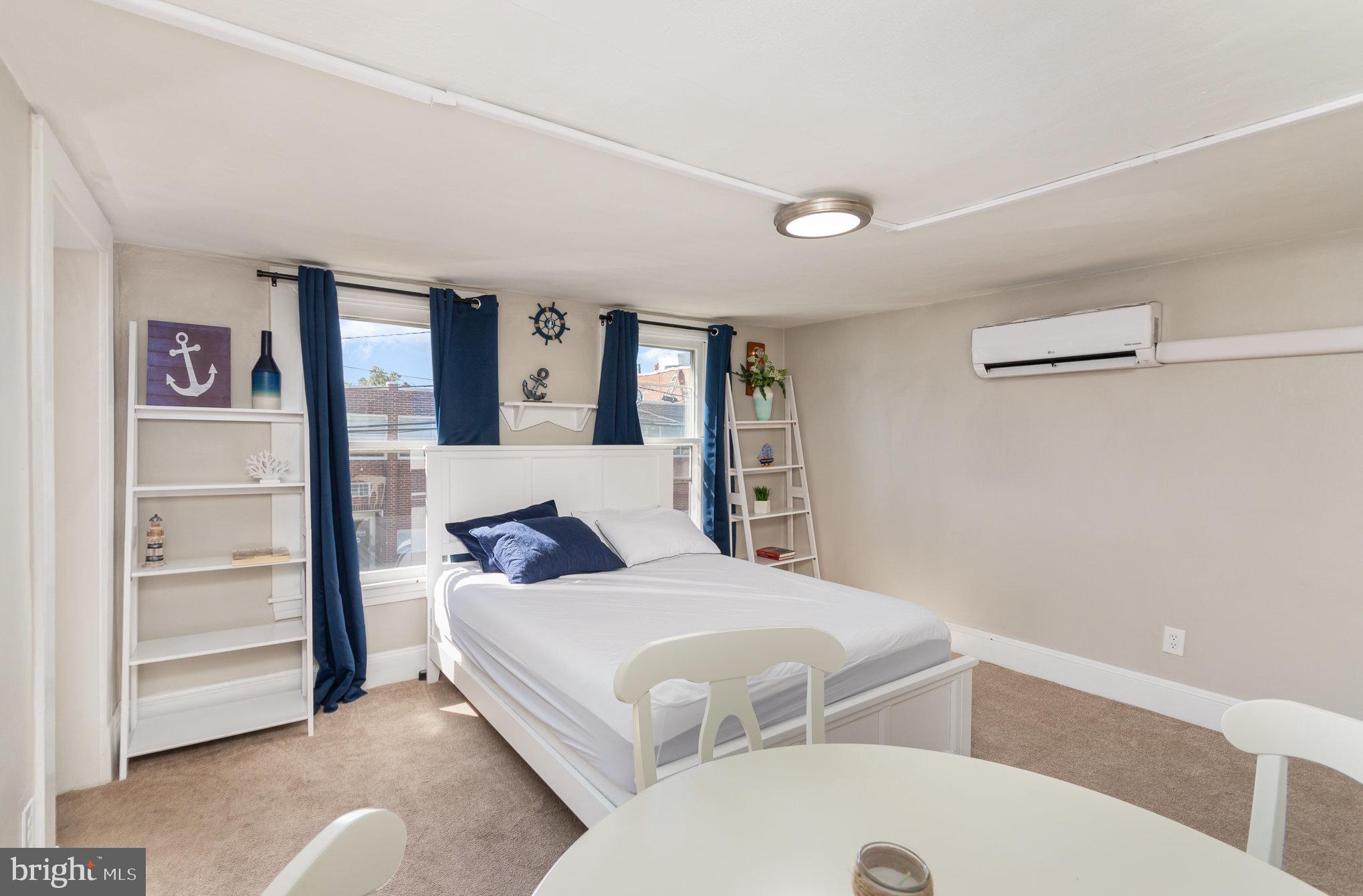 126 Prince George Street, Unit 4 Annapolis, MD 21401 - Photo 9 of 15 a bedroom with a bed and a cabinets