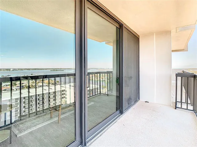 a view of a glass door and the balcony