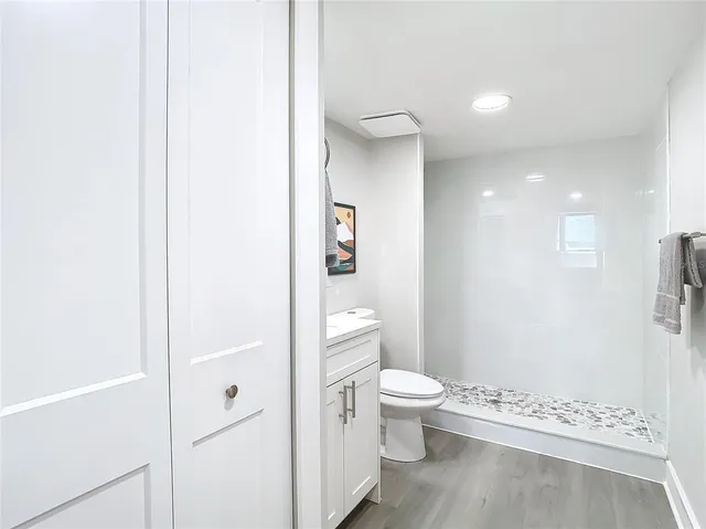 a bathroom with a toilet a sink and bathtub