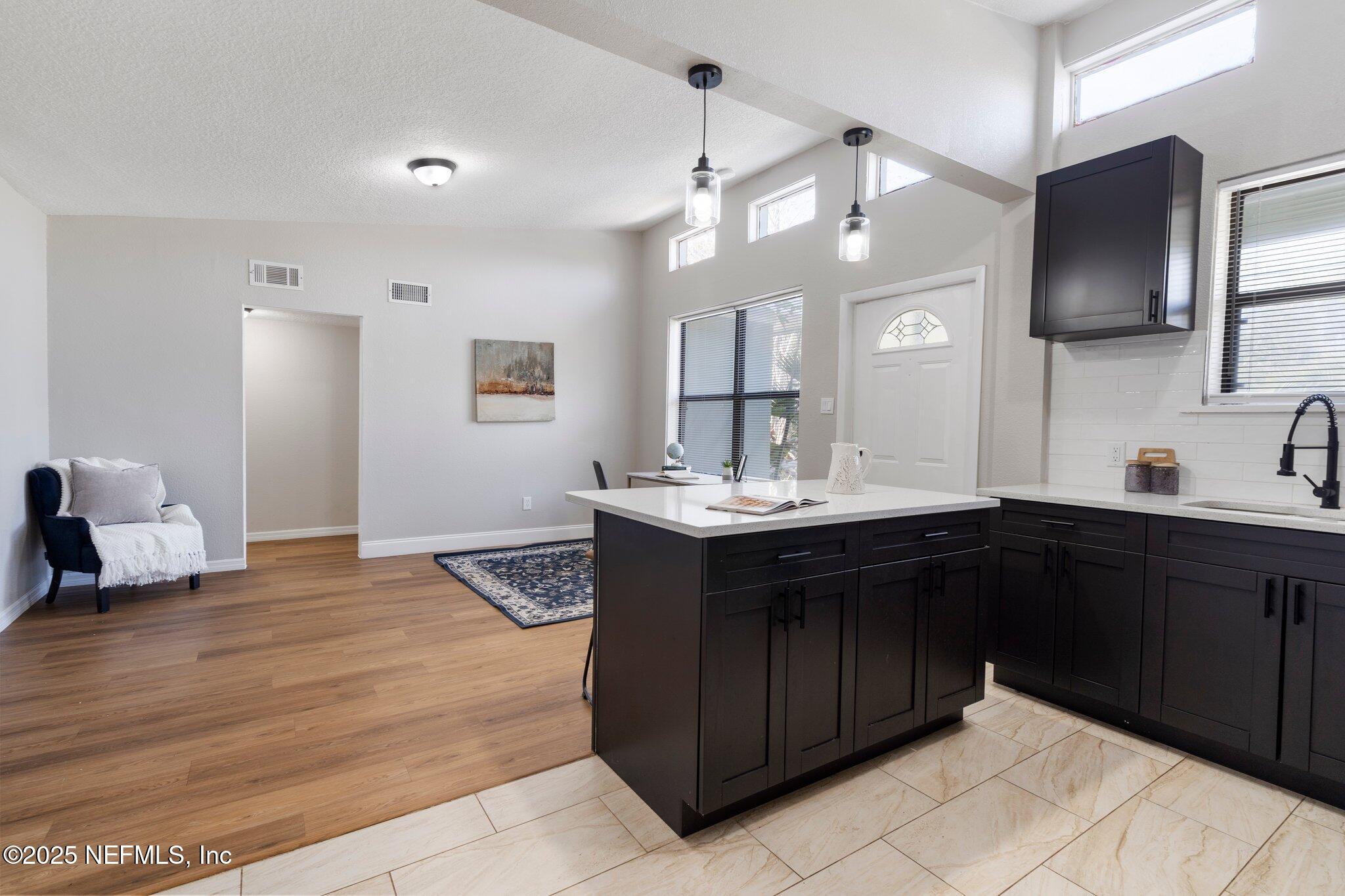 2838 Rainbow Road Jacksonville, FL 32217 - Photo 12 of 35 a spacious bathroom with a sink double vanity and a mirror