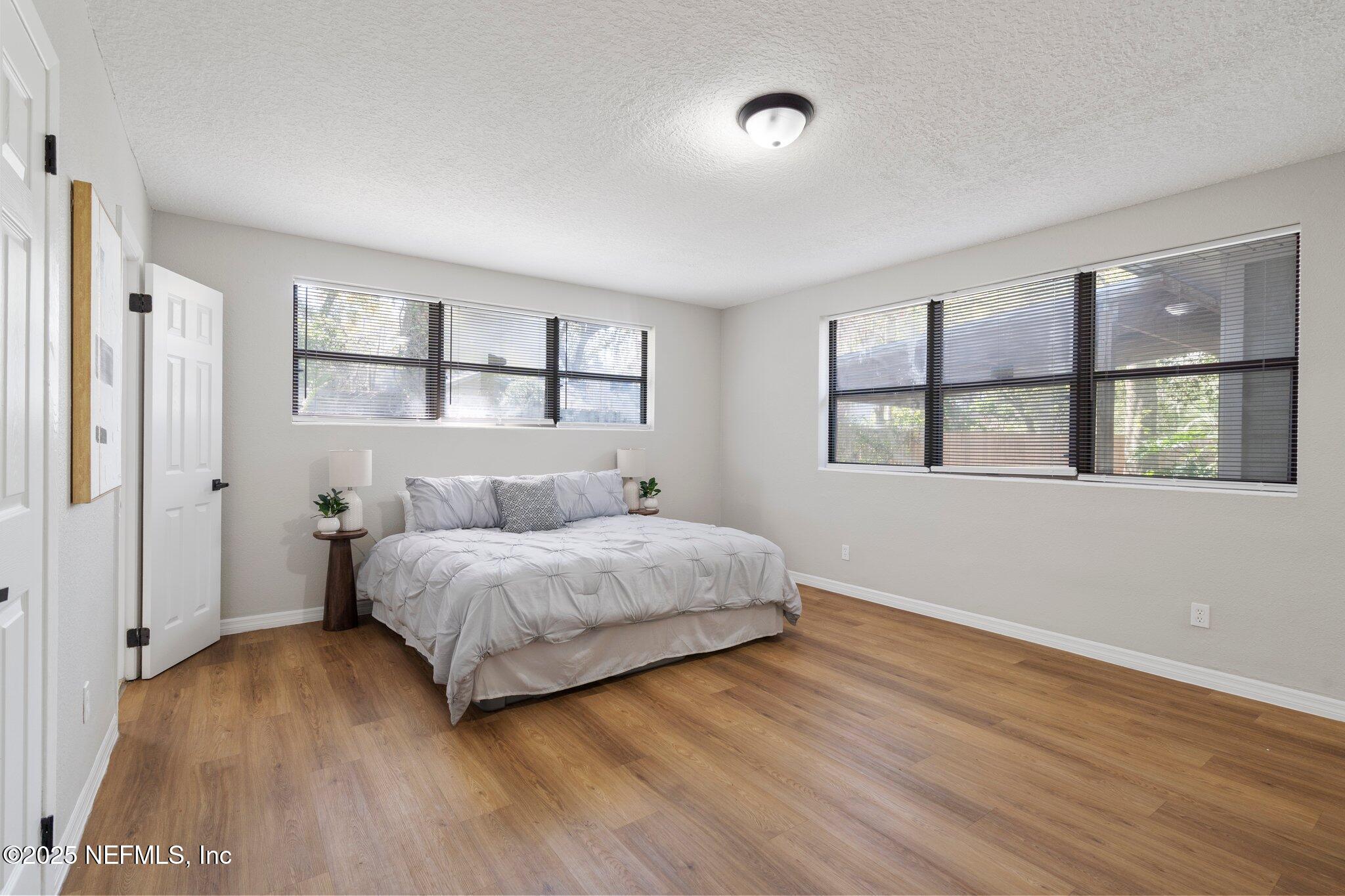 2838 Rainbow Road Jacksonville, FL 32217 - Photo 19 of 35 a spacious bedroom with a bed and a window